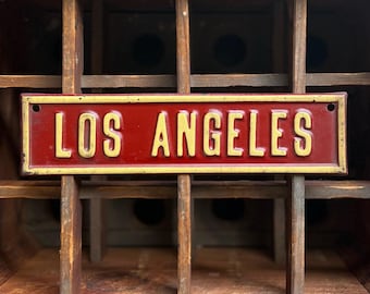 1930s Los Angeles Embossed Tin Automotive License Plate Topper Sign In Original Paint | Original Novelty Advertising Signage.