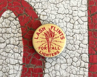 Original Lash Flints For All Lighters Pocked Tin C. 1920's Advertising Storage Tin With Flame Graphic.