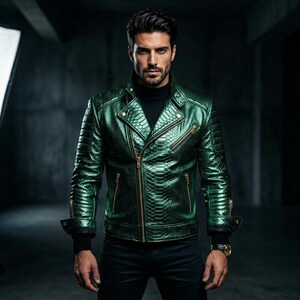 May include: A green, textured leather jacket with a snakeskin pattern. The jacket features a classic biker style with a zipper closure, multiple pockets, and gold-colored hardware. The model is wearing a black turtleneck and black pants.