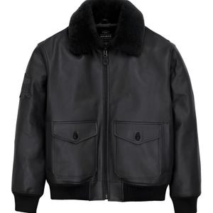 May include: A black leather bomber jacket featuring a black faux fur collar, a full-length front zipper, and two large front pockets with buttoned flaps. The jacket includes ribbed cuffs and a ribbed hem, with a patch on the right sleeve.