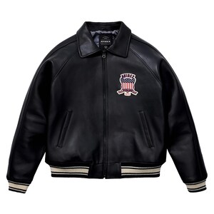 May include: A black leather jacket with a classic collar, a full-length front zip, and ribbed cuffs and hem featuring white stripes. On the left chest, there is a patch displaying the text AVIREX above a shield with a red, white, and blue flag design.