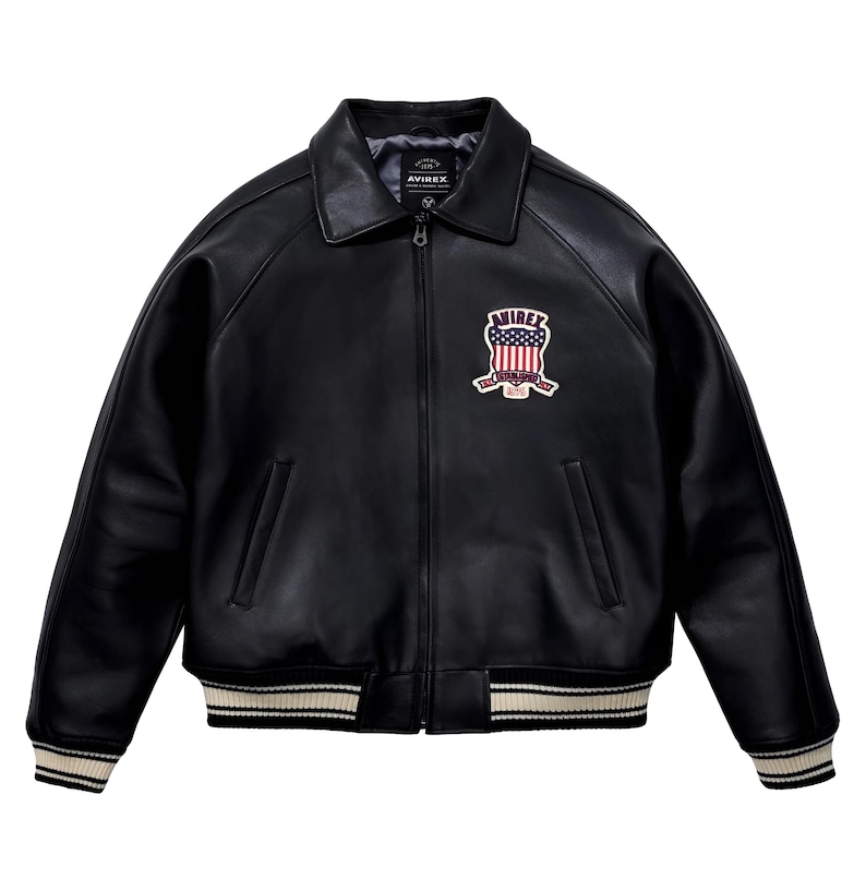 May include: A black leather jacket with a classic collar, a full-length front zip, and ribbed cuffs and hem featuring white stripes. On the left chest, there is a patch displaying the text AVIREX above a shield with a red, white, and blue flag design.