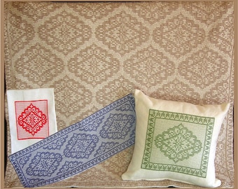 May include: Three woven fabric pieces with geometric patterns. A small red and white piece, a larger blue and white piece, and a white pillow with a green and white pattern.