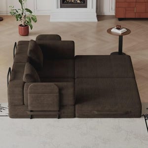 May include: A dark brown corduroy modular sofa bed featuring a textured fabric finish, black metal frame accents, and two back cushions. The piece is configured with one section in a seated position and the other extended flat as a bed.