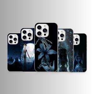 May include: A collection of phone cases featuring gothic-themed illustrations. Designs include a skeleton hand with a flower, a character in front of a full moon, and a ghostly figure. The cases are black with detailed, dark blue artwork.