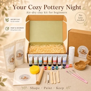May include: An air-dry clay kit for beginners featuring a brown cardboard box filled with straw, eight tubes of acrylic paint, a yellow sponge, a wooden rolling pin, sculpting tools, paintbrushes, and two pouches labeled Rolling Garden Pottery.