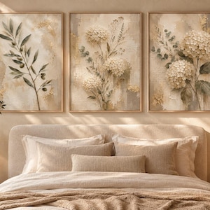 May include: A set of three rectangular framed wall art prints featuring botanical illustrations. The left print shows an olive branch, while the center and right prints depict clusters of white hydrangea flowers with green leaves on a textured beige background.