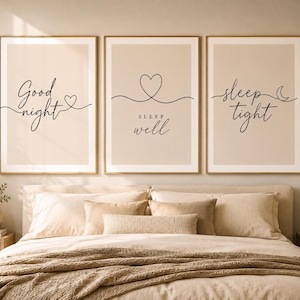 May include: A set of three vertical wall art prints with a beige background and black line art. The first print says Good night with a heart, the second says SLEEP well with a heart, and the third says sleep tight with a crescent moon symbol.