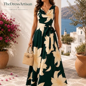 May include: A sleeveless floor-length dress in dark green with a large cream-coloured floral pattern, featuring a cowl neckline and a matching fabric tie-waist belt. The dress is paired with a small, structured, light-coloured woven handbag.