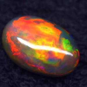 Zwarte vrolijke multi-fire Ethiopische opaal cabochon - losse natuurlijke edelsteen 7,30 ct