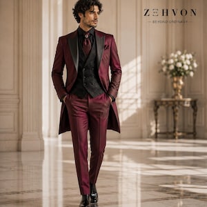 black dress shirt with burgundy bow tie Classic black with a pop of bold. This burgundy bow tie and pocket square combo is made for the groom who wants timeless with a twist., Reserve your wedding look today at baleystuxedos.com,