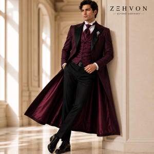 May include: A long burgundy coat with black lapels worn over a matching burgundy patterned vest, a white dress shirt, a burgundy tie, and black trousers. The text Z E H V O N BEYOND ORDINARY is visible in the upper right corner of the image.