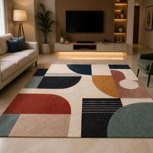 May include: A rectangular area rug featuring a geometric pattern with semi-circles, rectangles, and lines in a palette of cream, navy blue, terracotta red, mustard yellow, dusty pink, and muted teal, with a textured, plush pile surface.