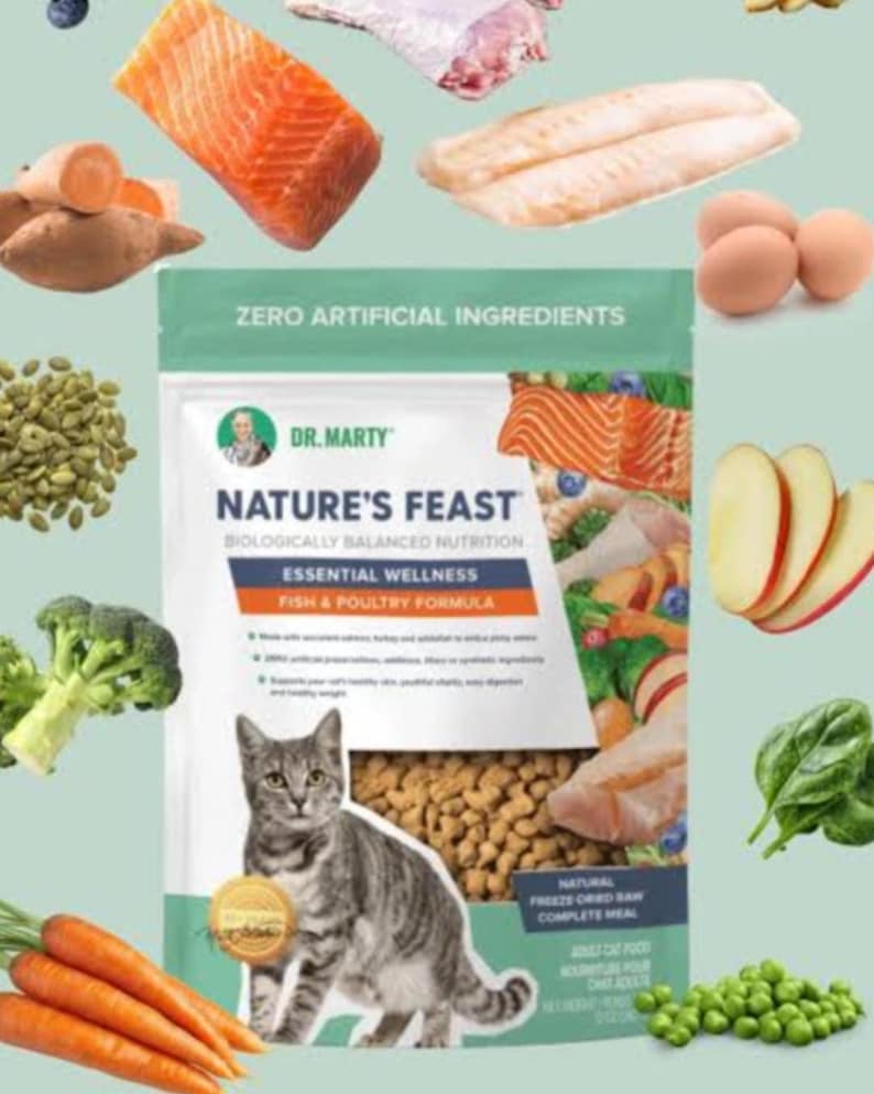 May include: A bag of Dr. Marty's Nature's Feast cat food with the text "ZERO ARTIFICIAL INGREDIENTS". The bag features a cat and various ingredients like salmon, eggs, and carrots. The product is a fish and poultry formula.