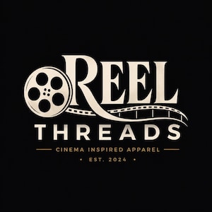 May include: A logo design on a black background featuring the text REEL THREADS in a serif font. The letter R is integrated with a film reel and a strip of film. Below the main text is the phrase CINEMA INSPIRED APPAREL and EST. 2024.