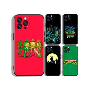 May include: Five smartphone cases featuring Teenage Mutant Ninja Turtles graphics. One large red case shows the four turtles standing together. Four smaller cases include black backgrounds with action scenes, a silhouette against a moon, and a green case with the logo.