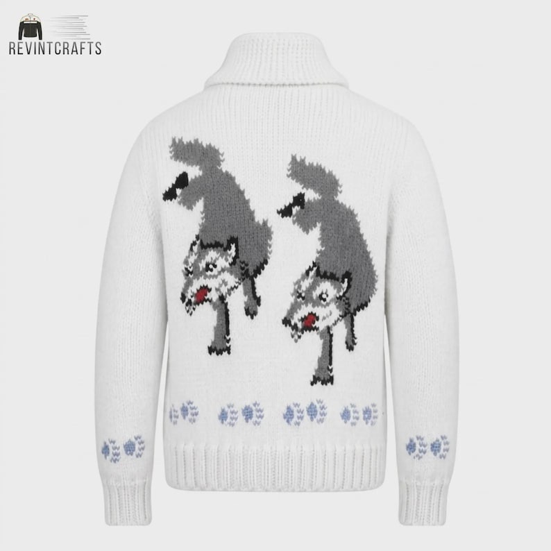 May include: A white knit sweater featuring a shawl collar and long sleeves. The back displays two grey wolf illustrations with red accents, positioned above a row of light blue paw prints. Additional light blue paw prints decorate each sleeve cuff.