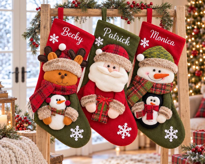 May include: Three personalized Christmas stockings featuring embroidered names Becky, Patrick, and Monica. The stockings display plush appliqu&eacute;s of a reindeer, Santa Claus, and a snowman, each wearing winter accessories and holding small holiday figures.
