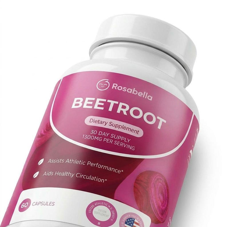 May include: A white bottle of Rosabella Beetroot dietary supplement. The label is pink and white, with text that reads "BEETROOT" and "30 DAY SUPPLY 1300MG PER SERVING." It also states that it assists athletic performance and aids healthy circulation. The bottle contains 60 capsules.