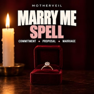 May include: A diamond ring sits inside a dark red velvet box next to a lit white candle. The text reads MOTHERVEIL MARRY ME SPELL COMMITMENT PROPOSAL MARRIAGE. The ring features a single round stone set on a thin band, illuminated by the candle flame.