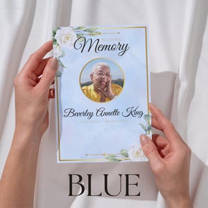 May include: A memorial card with a photo of a person in a gold-framed circle, with the words "In Loving Memory" at the top. The name "Beverley Annette King" is below the photo, with dates. The card has a blue background with floral accents and the word "BLUE" at the bottom.
