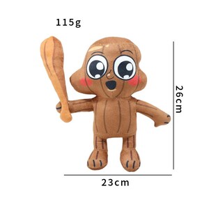 K&ouml;nnte beinhalten: Braunes Pl&uuml;schtier in Form einer Zeichentrickfigur, die einen beigefarbenen Schl&auml;ger h&auml;lt. Das Spielzeug hat gro&szlig;e Augen und rosige Wangen und ist 26 cm hoch und 23 cm breit. Es wiegt 115g.