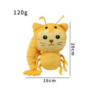 K&ouml;nnte beinhalten: Ein Pl&uuml;schtier in Form eines Katze-Hummer-Hybriden. Das Spielzeug ist &uuml;berwiegend orange mit schwarzen Augen und Schnurrhaaren. Es ist 20 cm hoch und 16 cm breit und wiegt 120g. Das Spielzeug hat ein Katzen-Gesicht und einen Hummer-Schwanz.