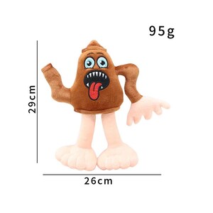 K&ouml;nnte beinhalten: Ein braunes Pl&uuml;schtier in Form einer Zeichentrickfigur mit weit ge&ouml;ffnetem Mund, herausgestreckter Zunge und gro&szlig;en Augen. Das Spielzeug ist 29 cm hoch, 26 cm breit und wiegt 95 g.