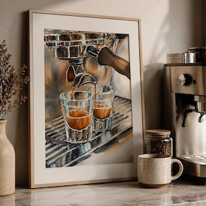 Może przedstawiać: Oprawiony wydruk akwarelowy przedstawiający espresso wlewane do dwóch przezroczystych szklanek. Grafika przedstawia chromowany ekspres do kawy z brązowym uchwytem. Widoczny jest również ceramiczny kubek i słoik z ziarnami kawy.