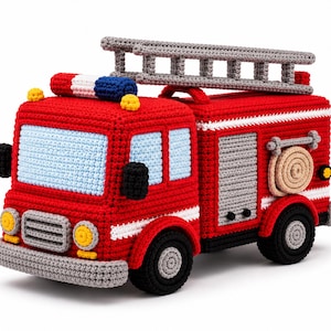 May include: A crocheted fire truck toy in vibrant red with a light blue windshield, a grey ladder on top, black wheels, and a coiled tan hose on the side. The vehicle features yellow headlights, a red, white, and blue light bar, and grey accents.