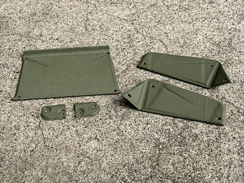 May include: A set of five olive green, textured, rigid components including one large rectangular panel, two elongated angled side pieces, and two small square mounting brackets, all featuring pre-drilled holes for assembly and installation.