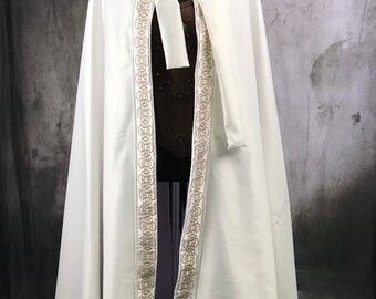 White cloak with gold embroidery