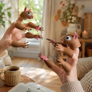 May include: A set of brown squirrel finger puppets featuring two detailed squirrel heads with pink ears and black eyes, along with several matching squirrel arms and hands with pink palms and black claws, designed to fit individually on each finger.