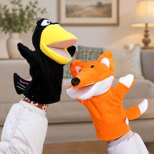 May include: A black crow hand puppet with a large yellow beak and a white eye, alongside an orange fox hand puppet featuring a white chest, white-tipped ears, a black nose, and a white-tipped tail. Both puppets have open mouths and soft fabric.