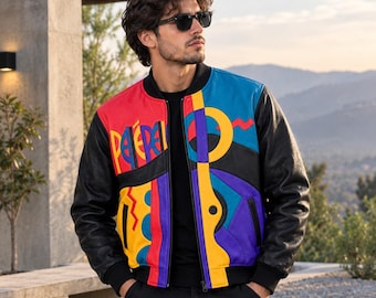 May include: A multi-colored bomber jacket featuring black leather sleeves and a vibrant front panel with red, yellow, blue, and purple geometric shapes. The jacket includes a black ribbed collar, cuffs, and hem, with the text "PEPE" printed on the chest.
