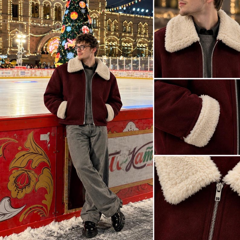 May include: A burgundy jacket featuring a white sherpa collar and matching sherpa cuffs on the sleeves. The jacket has a full-length silver metal zipper closure down the front and is worn over a grey sweater with grey trousers and black shoes.