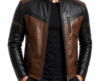 May include: A two-tone leather jacket in black and brown. The jacket features a stand-up collar, multiple zippered pockets, and a front zipper closure. The sleeves have zippered cuffs and the jacket has a classic biker style.