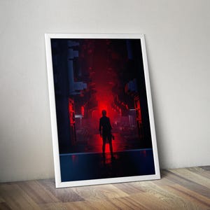 Puede incluir: Una impresión de arte mural vertical enmarcada que muestra la silueta de una persona de pie en un pasillo industrial oscuro, iluminado por una fuente de luz roja brillante e intensa al final del camino, creando una escena de alto contraste.