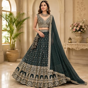 May include: A dark green lehenga choli set featuring a sleeveless blouse and a floor-length skirt with intricate gold embroidery, sequin detailing, and a matching sheer dupatta draped over the shoulder, showcasing a traditional South Asian aesthetic.