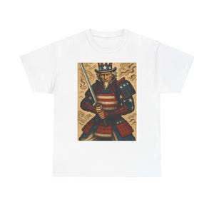 May include: White t-shirt featuring a graphic of Uncle Sam in samurai armor, holding a katana. The artwork incorporates the American flag's colors and stars. The design is centered on the shirt.