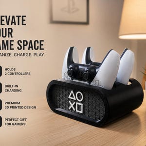 May include: A black 3D printed charging dock for two game controllers, featuring white PlayStation symbols on the front. The text on the image reads: ELEVATE YOUR GAME SPACE, ORGANIZE. CHARGE. PLAY., HOLDS 2 CONTROLLERS, BUILT-IN CHARGING, PREMIUM 3D PRINTED DESIGN, PERFECT GIFT FOR GAMERS.