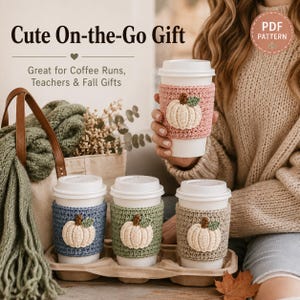 May include: Four white disposable coffee cups featuring crocheted sleeves in pink, blue, sage green, and beige. Each sleeve displays a small, cream-colored crocheted pumpkin with a green leaf. Text reads: Cute On-the-Go Gift, PDF PATTERN.