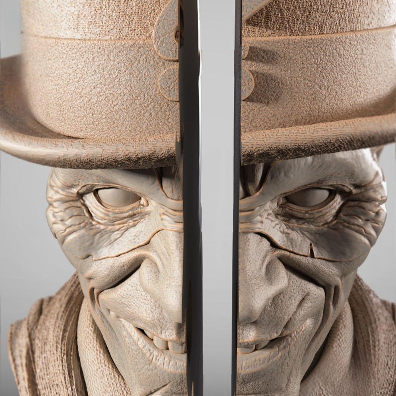 May include: A detailed sculpture of a smiling, pale-skinned figure wearing a hat and a textured jacket. The figure has a wide grin, visible teeth, and detailed facial features. The sculpture is in a neutral color palette.