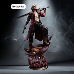May include: A detailed figurine of a character from a video game, standing on a monster base. The figure wears a red coat, black pants, and brown boots, holding a sword and a gun. The word "Bestseller" is in a white oval.