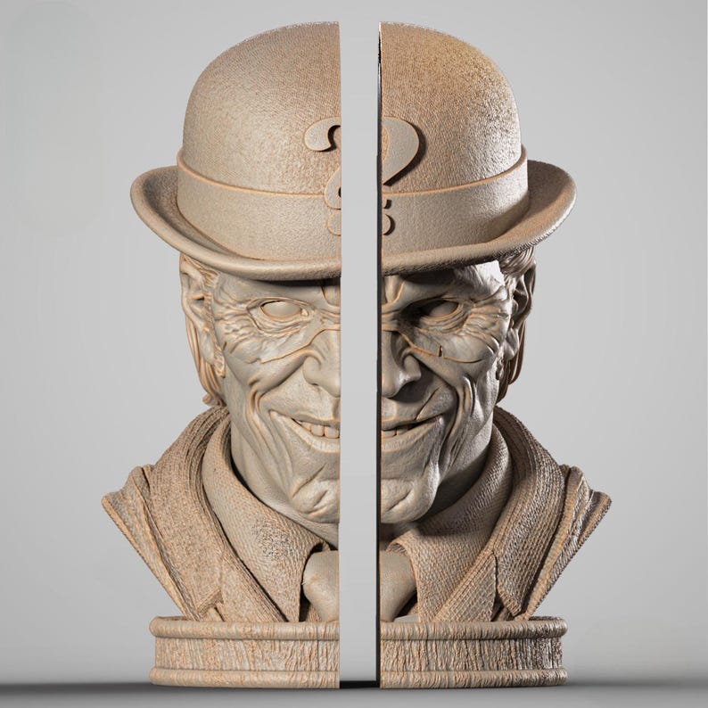 May include: A pair of beige bookends shaped like a bust of a smiling man wearing a bowler hat. The hat has a decorative cutout. The bookends are split down the middle, creating two separate pieces. The bust is detailed with wrinkles and facial features.
