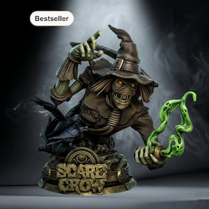 Può includere: Busto dettagliato di uno spaventapasseri dall'espressione minacciosa, con cappello marrone e abiti laceri. La figura tiene in mano un oggetto verde brillante ed è accompagnata da un corvo. La base recita "Scare Crow".