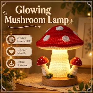 May include: A crochet mushroom lamp featuring a large red cap with white spots and two smaller mushrooms on a wooden base. The text reads Glowing Mushroom Lamp, Crochet Pattern PDF, Beginner Friendly, and Instant Download in white boxes.