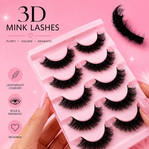 May include: A set of five pairs of black 3D mink lashes arranged in a pink plastic tray. The packaging features the text 3D MINK LASHES, FLUFFY, VOLUME, DRAMATIC, LIGHTWEIGHT COMFORT, BOLD & DRAMATIC, and REUSABLE alongside icons of a feather, eye, and heart.