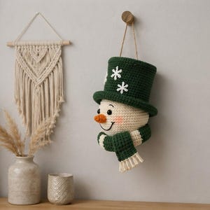 Crochet Snowman Wall Hanging Pattern, Christmas Door Decor, Amigurumi Snowman PDF, Winter Holiday Crochet Pattern, Handmade Decor
Christmas Ornament Crochet Pattern PDF, Snowman Wall Hanging, Amigurumi Holiday Decor, Instant Download 
Crochet Snowman Wreath Pattern, Christmas Wall Hanging Decor (PDF Download)