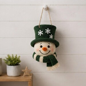 Crochet Snowman Wall Hanging Pattern, Christmas Door Decor, Amigurumi Snowman PDF, Winter Holiday Crochet Pattern, Handmade Decor
Christmas Ornament Crochet Pattern PDF, Snowman Wall Hanging, Amigurumi Holiday Decor, Instant Download 
Crochet Snowman Wreath Pattern, Christmas Wall Hanging Decor (PDF Download)